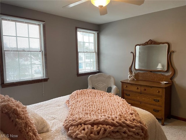 bedroom featuring ceiling fan and carpet flooring