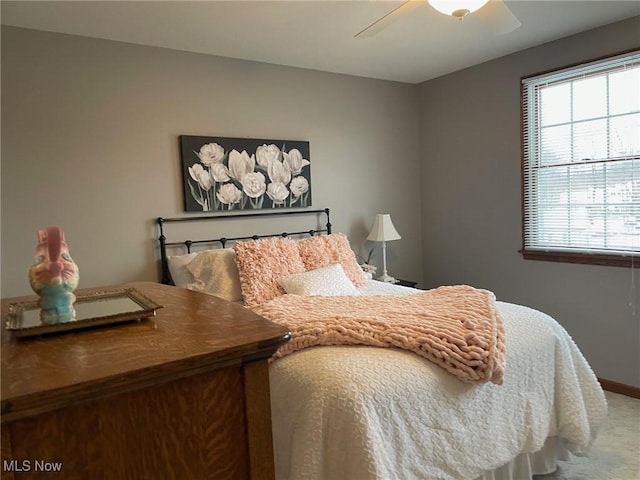 bedroom with ceiling fan and carpet floors