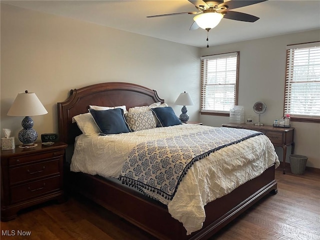 bedroom featuring ceiling fan and dark hardwood / wood-style floors