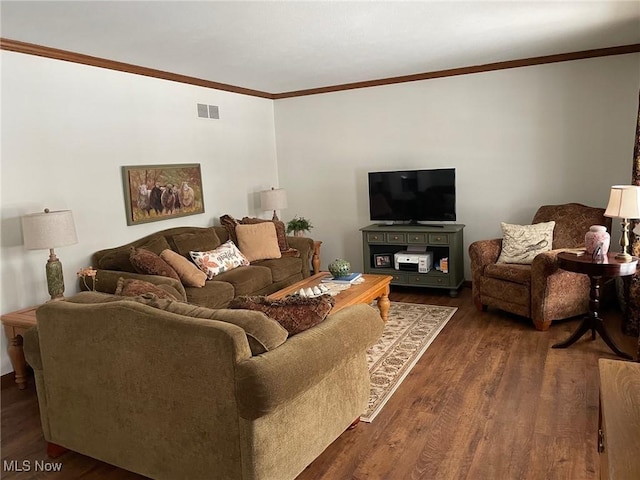 living room with crown molding and dark hardwood / wood-style floors