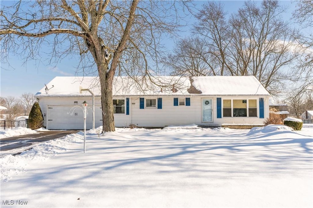 single story home with a garage