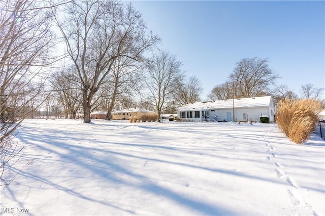 view of yard covered in snow