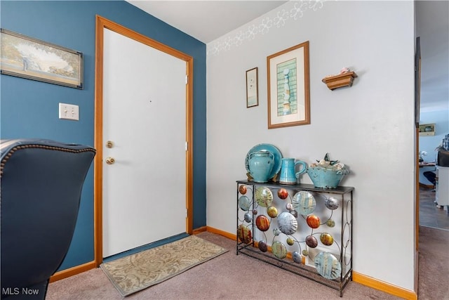 view of carpeted entrance foyer