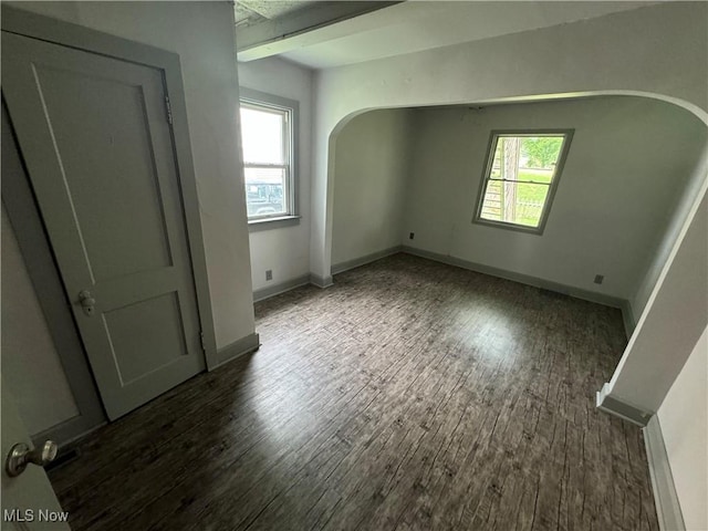 empty room featuring dark hardwood / wood-style floors