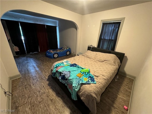 bedroom featuring dark hardwood / wood-style floors