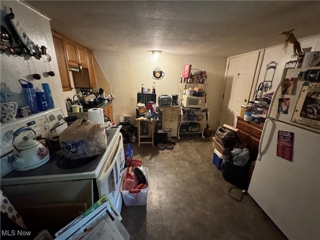 kitchen featuring a textured ceiling and washer / dryer