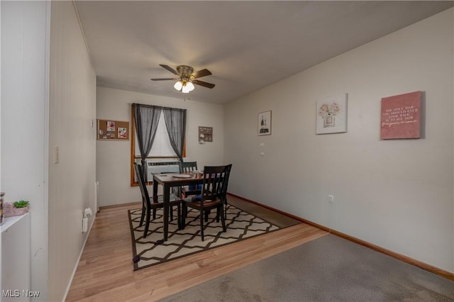 dining room featuring ceiling fan and light hardwood / wood-style flooring