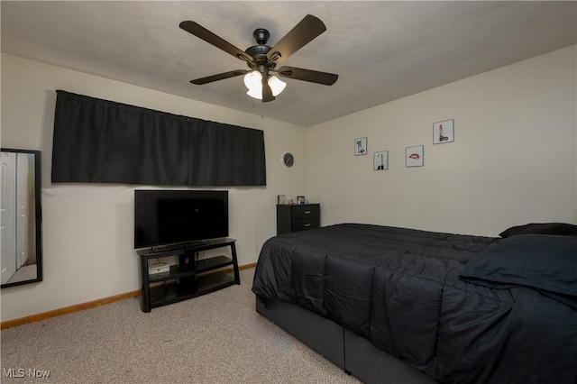 bedroom featuring light carpet and ceiling fan