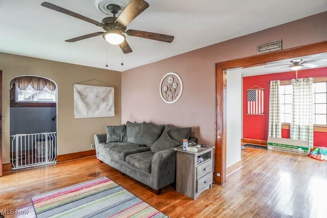 living room featuring hardwood / wood-style flooring and ceiling fan