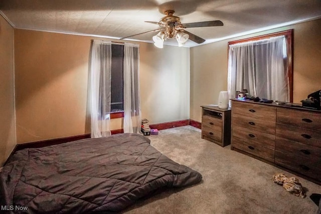 bedroom with ceiling fan and carpet