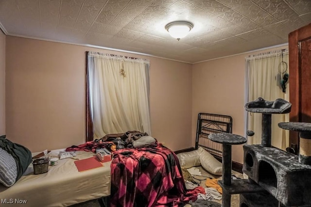 bedroom with crown molding