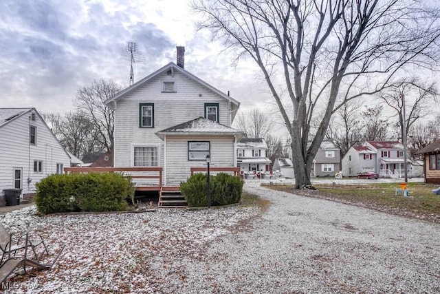 rear view of property with a deck