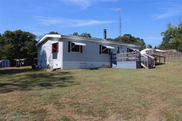 view of front of house with a front lawn and a deck