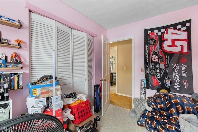 carpeted bedroom featuring a closet