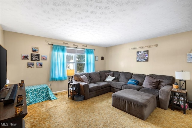 living room with a textured ceiling and carpet flooring