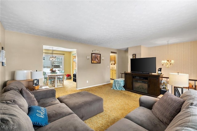 living room featuring carpet and an inviting chandelier