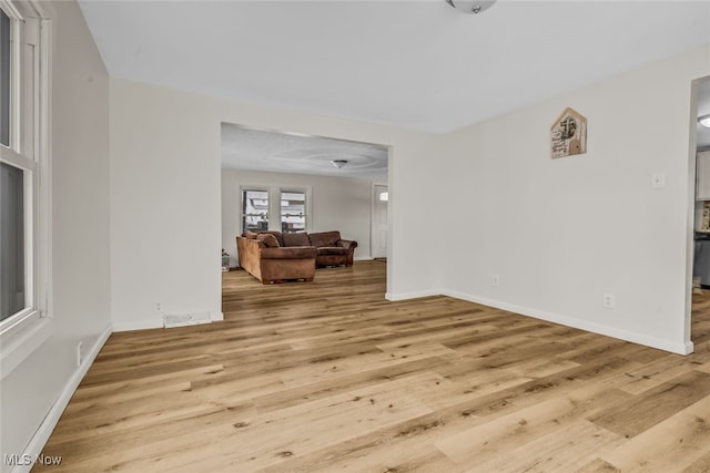 unfurnished room with light hardwood / wood-style floors