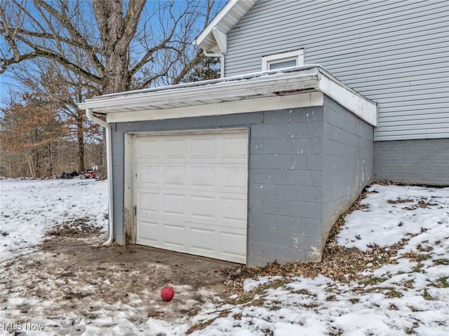 view of snow covered garage