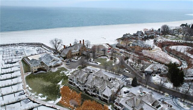 drone / aerial view featuring a beach view and a water view