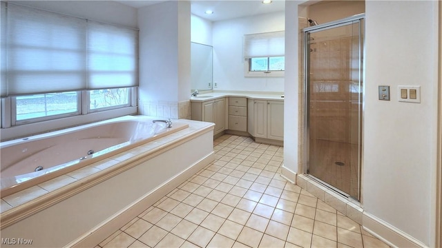 bathroom with vanity, independent shower and bath, and tile patterned flooring