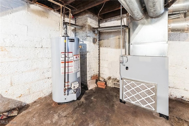 utility room featuring heating unit and water heater