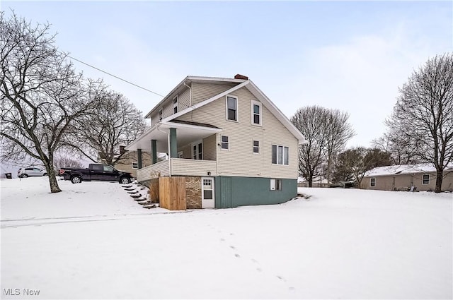 view of snow covered property