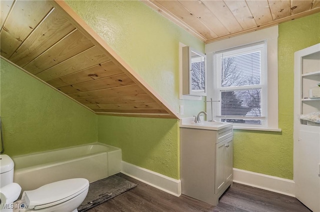 bathroom featuring toilet, wood ceiling, hardwood / wood-style flooring, a washtub, and vanity