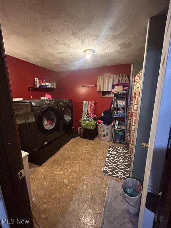 laundry room with washing machine and dryer