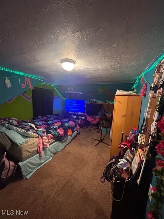 carpeted bedroom featuring a textured ceiling