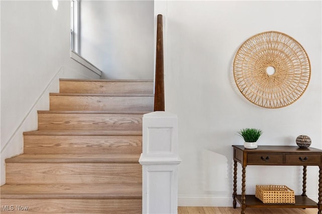 staircase featuring hardwood / wood-style floors