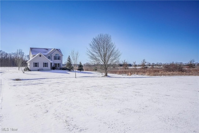 view of yard layered in snow