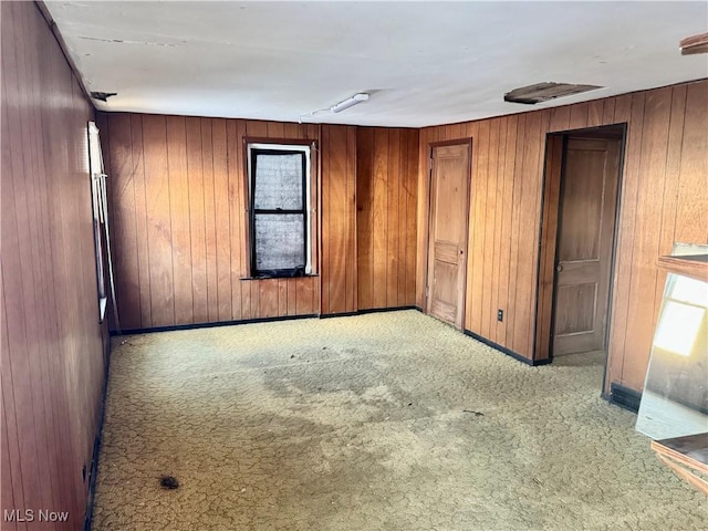 unfurnished room with light colored carpet