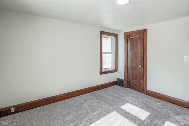 view of carpeted spare room