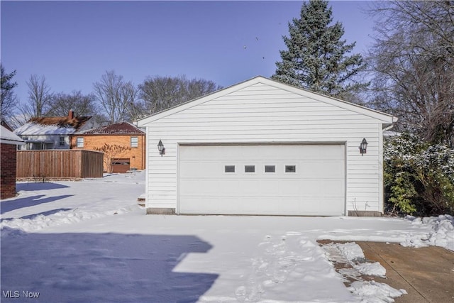 view of snow covered garage