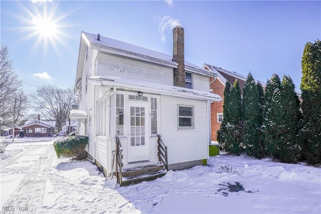 view of snow covered house