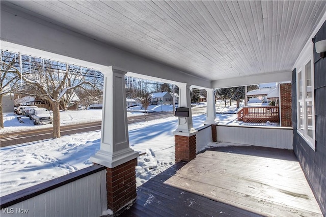 view of snow covered deck