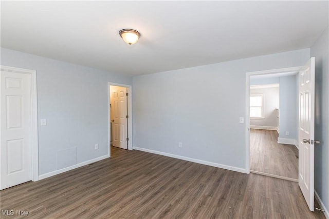 empty room featuring dark hardwood / wood-style floors