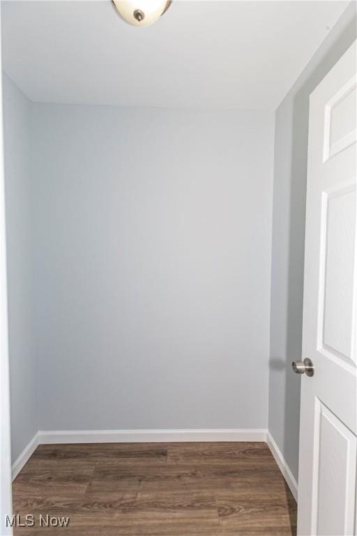 spare room featuring dark hardwood / wood-style flooring