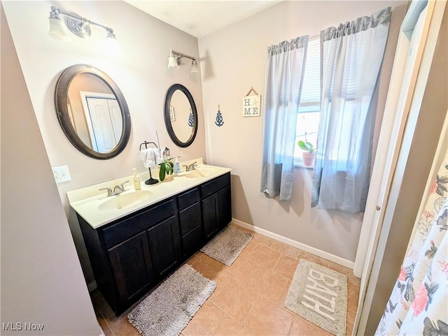 bathroom with vanity and tile patterned flooring