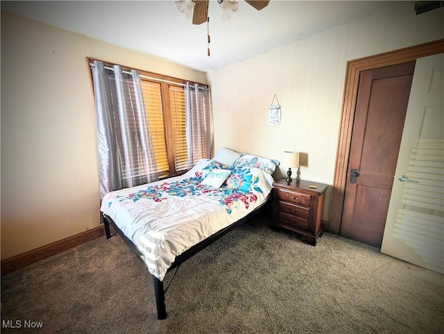 bedroom with ceiling fan and carpet