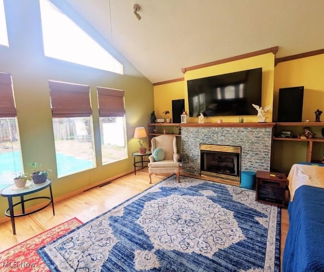 914 27th St, Parkersburg, WV 26104 - living area with plenty of natural light, wood finished floors, a fireplace, and ornamental molding