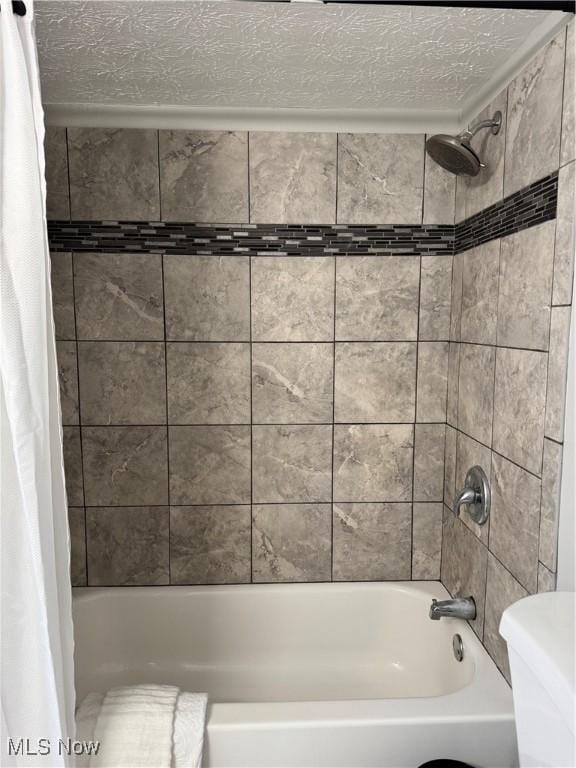 bathroom with shower / bath combo with shower curtain