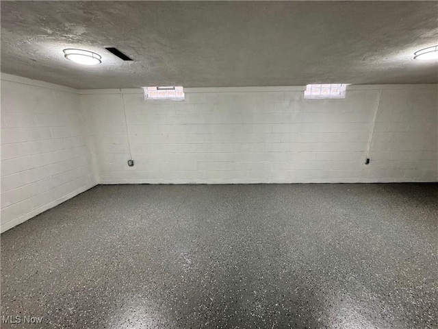 basement with a textured ceiling