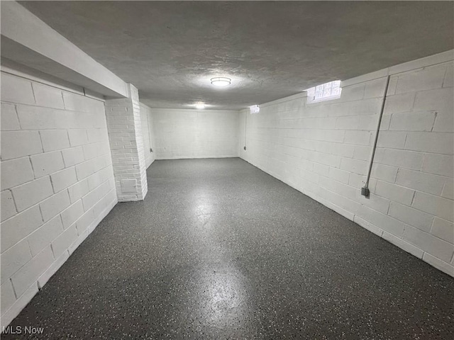 basement with a textured ceiling