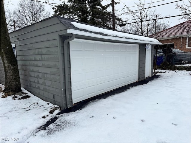 view of snow covered garage