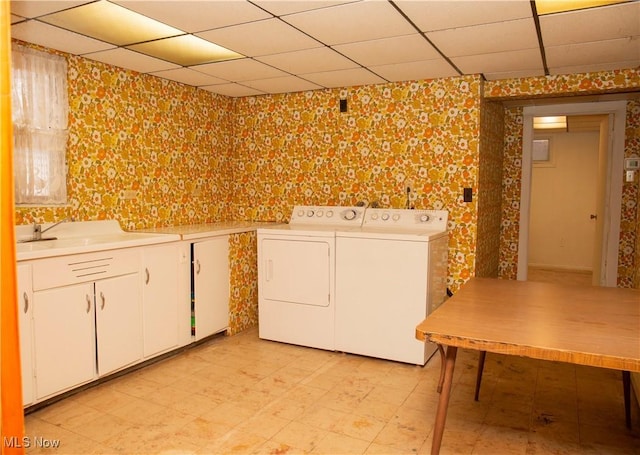 laundry area with cabinets and separate washer and dryer