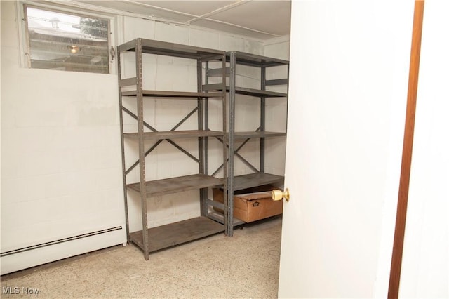 storage area featuring baseboard heating