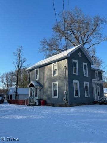 view of snow covered property