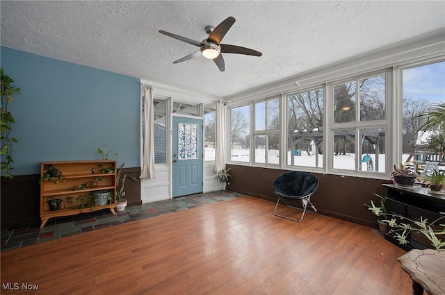 sunroom / solarium with ceiling fan