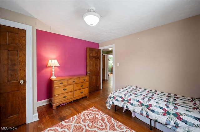 bedroom with hardwood / wood-style floors